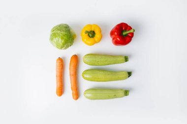 Fresh vegetables on a white background. Top view, flat lay.