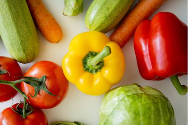 Fresh vegetables on a white background. Top view, flat lay.