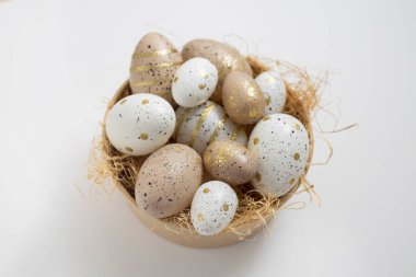 Easter eggs in a vase for decoration on a white background.