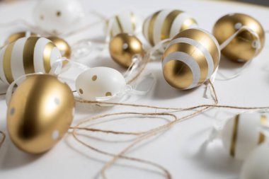 Beautiful Easter eggs on a white background. View from above.