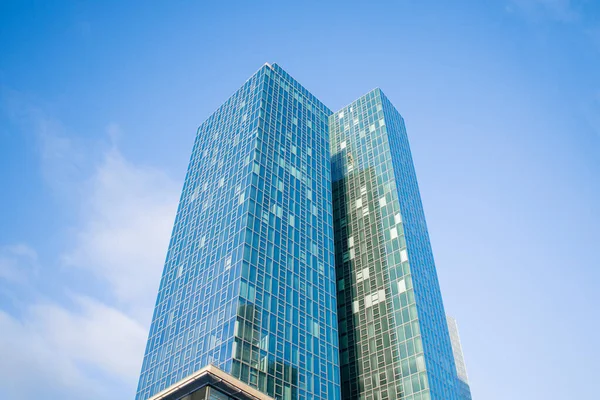 stock image Skyscraper against a blue sky without clouds.