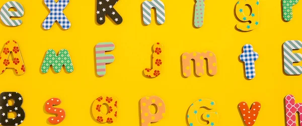 Many Multi Colored Letters Alphabet Yellow Background Top View Flat — Stock Photo, Image