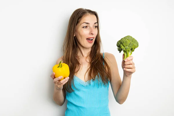 Surprised Young Woman Holding Broccoli Paprika White Background Royalty Free Stock Images