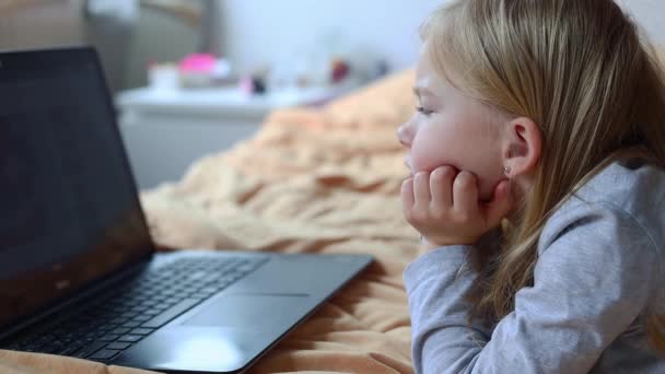 Child Girl Lying Sofa Watching Cartoons Laptop — Stock Video