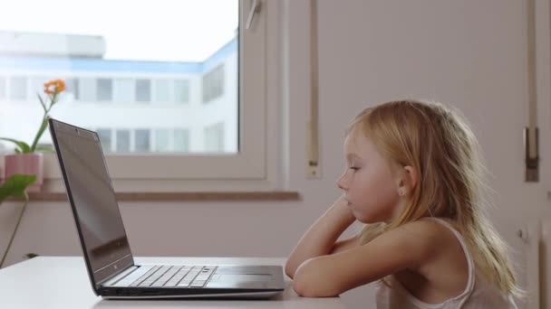 Child Girl Rubs Her Eyes Wants Sleep While Sitting Laptop — Stock Video