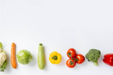 Fresh vegetables on a white background. Top view, flat lay.