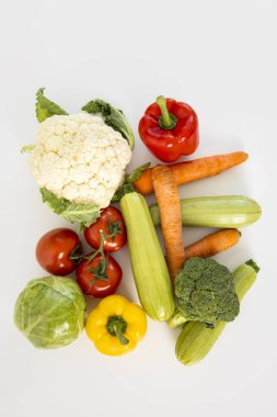 Fresh vegetables on a white background. Top view, flat lay.