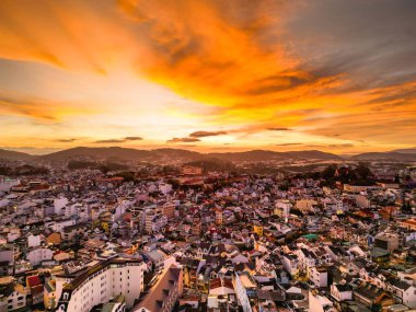 Radiant Sunset Skyline: Captivating Red Sky View of Da Lat City, Vietnam with a Stunning Blend of Colors between Cityscape and Sky at Dusk
