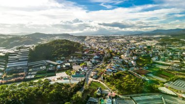 Mesmerizing Mountain Skyline: HDR Shot of Da Lat City, Vietnam with Stunning Blue Sky and Majestic Mountains on the Horizon