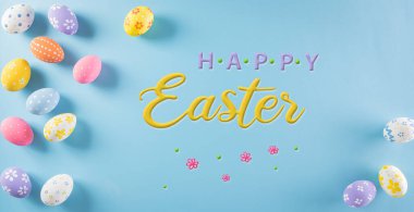 Happy easter! Colourful of Easter eggs in with flower and the text on pastel background. Greetings and presents for Easter Day celebrate time.