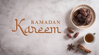 Ramadan food and drinks concept. Ramadan tea and dates fruits with the text on dark background.