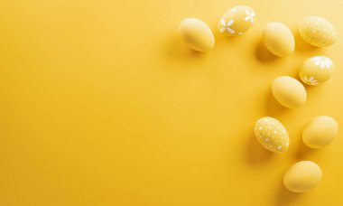 Happy easter! Colourful Easter eggs on yellow background. Decoration concept for greetings and presents on Easter Day celebrate time.