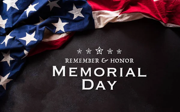 Happy Memorial day concept made from American flag and the text on dark stone background.