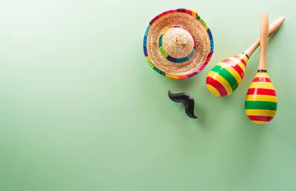 stock image Cinco de Mayo holiday background made from maracas, mexican blanket stripes or poncho serape and hat on pastel background.