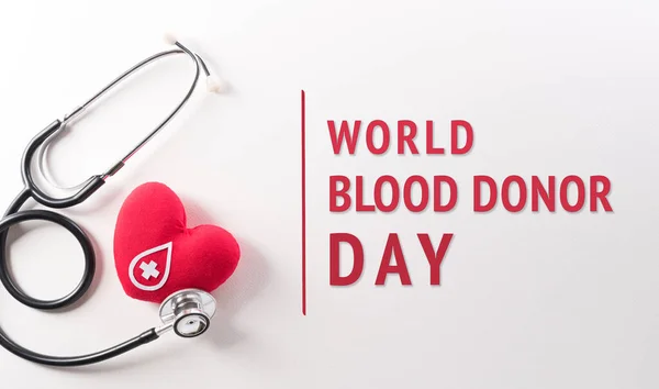 World blood donor day, red cross and nurse day concept made from red heart and stethoscope on white background.