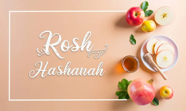 Rosh hashanah (Jewish New Year holiday), Concept of traditional or religion symbols on pastel orange paper background.