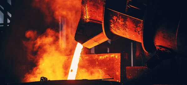 Metal casting process. Furnace in Steel Mill metallurgical factory. Horizontal banner photo.