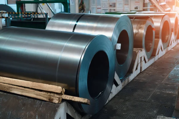 Rolls of steel sheets. Metal coils in metalwork factory workshop.