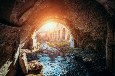 View from inside of sewer tunnel, old tunnel for river or sewage with sunlight.
