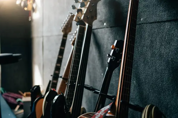 stock image Music instruments in room. Guitars stay in row. Sound recording studio background.