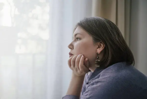 stock image Sad Plus-Size Woman Alone by Window. 