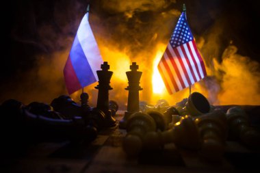War between Russia and Ukraine, conceptual image of war using chess board, soldiers and national flags on the background of explosion. Ukrainian and Russian crisis. Selective focus