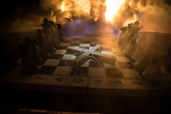 Concept of war or manipulation with global politics. Conceptual image of war using chess board and manipulation symbol. Selective focus