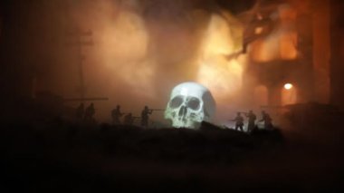 Concept of death soldiers during the war. Skeleton with military fighting silhouettes in destroyed city. Selective focus