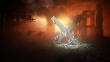 Concept of war or manipulation with global politics. Night battle scene. Military fighting silhouettes in destroyed city. Selective focus 