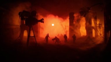 Action (War) movie concept. Burned out city destroyed in war. Military fighting silhouettes. Selective focus
