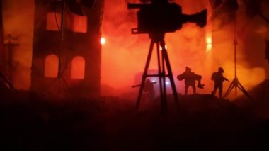 Action (War) movie concept. Burned out city destroyed in war. Military fighting silhouettes. Selective focus