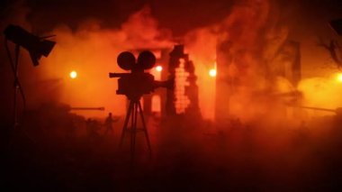 Action (War) movie concept. Burned out city destroyed in war. Military fighting silhouettes. Selective focus