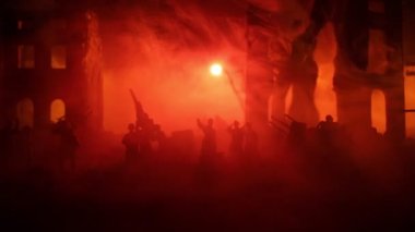 War Concept. Military silhouettes fighting scene on war fog sky background, World War Soldiers Silhouettes Below Cloudy Skyline At night. Battle in ruined city. Selective focus 