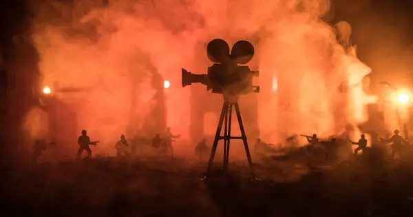 Action (War) movie concept. Military fighting silhouettes in destroyed city. Night scene. Selective focus