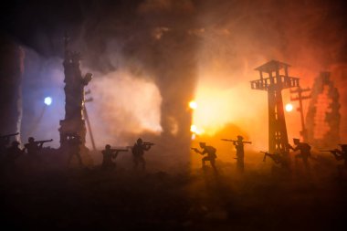 Conceptual image of war between Democracy and dictatorship using toy soldiers. Battle in ruined city. Selective focus