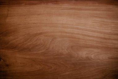Eski doğal ceviz desenli, koyu ahşap arka plan yüzeyi. Kahverengi ahşap yüzey doğası pürüzsüzler için kırsaldır. Tahta tahta kontrplak çam, tasarım ve dekorasyon için en üst masa..
