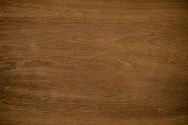 Eski doğal ceviz desenli, koyu ahşap arka plan yüzeyi. Kahverengi ahşap yüzey doğası pürüzsüzler için kırsaldır. Tahta tahta kontrplak çam, tasarım ve dekorasyon için en üst masa..