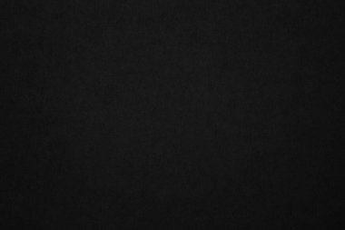 Black paper texture background. Black blank cardboard sheet page. Old vintage page dark grunge vignette. Pattern rough art rustic grunge letter. Material cardboard with copy space for luxury text.