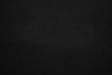 Black paper texture background. Black blank cardboard sheet page. Old vintage page dark grunge vignette. Pattern rough art rustic grunge letter. Material cardboard with copy space for luxury text.