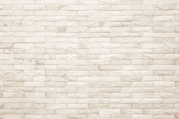 stock image Empty background of wide cream brick wall texture. Beige old brown brick wall concrete or stone textured, wallpaper limestone abstract. Cream and white brick wall. Brickwork flooring pattern design.