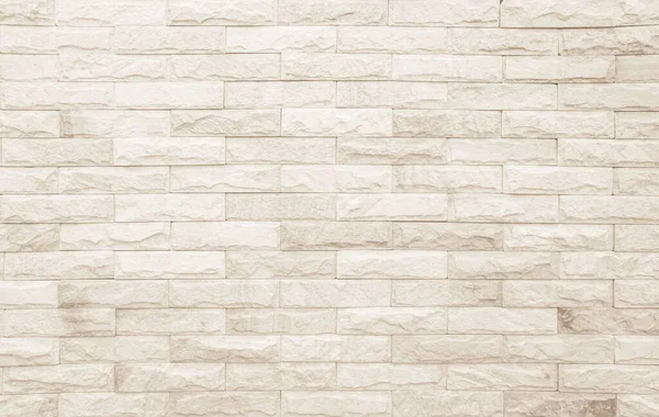 stock image Empty background of wide cream brick wall texture. Beige old brown brick wall concrete or stone textured, wallpaper limestone abstract. Cream and white brick wall. Brickwork flooring pattern design.