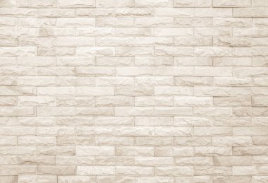 Geniş krem tuğla duvar dokusunun boş arkaplanı. Bej rengi eski tuğla duvar beton ya da taş desenli, duvar kağıdı kireçtaşı soyut. Krema ve beyaz tuğla duvar. Tuğla döşeme şablonu tasarımı.