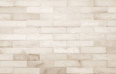 Geniş krem tuğla duvar dokusunun boş arkaplanı. Bej rengi eski tuğla duvar beton ya da taş desenli, duvar kağıdı kireçtaşı soyut. Krema ve beyaz tuğla duvar. Tuğla döşeme şablonu tasarımı.
