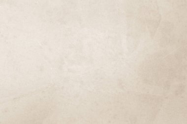 Renkli eski beton duvar dokusu arka planı. Retro düz krem rengi çimento duvar arkaplan dokusunu kapatın. Kağıt vintage parşömen ögesini görüntüde göster, tanıt veya tanıt.