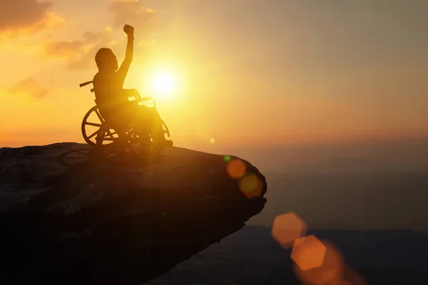 Silhouette Disabled Man Have Hope Wheelchair Raised Fist Look Sunset — Stock Photo, Image