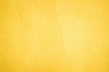 Yaz duvar kağıdındaki arka plan için sarı beton doku. Çimento ve tondan oluşan kum duvar çok az. Açık sarı renkli beton duvar, ev dekorasyonu için çimento dokusu beyaz..