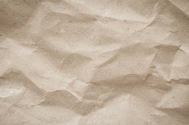 Arka plan için eski kağıt kumaş yüzeyi. Geri dönüşüm soluk kahverengi kağıt buruşuk doku, krem rengi geri dönüştürülmüş Kraft kağıt dokusu ve metin alanı için boş metin alanı.