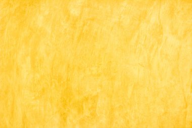 Yaz duvar kağıdındaki arka plan için sarı beton doku. Çimento ve tondan oluşan kum duvar çok az. Açık turuncu renkli beton duvar, ev dekorasyonu için beyaz çimento dokusu..