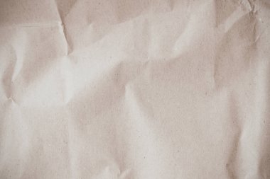 Arka plan için eski kağıt kumaş yüzeyi. Geri dönüşüm soluk kahverengi kağıt buruşuk doku, krem rengi geri dönüştürülmüş Kraft kağıt dokusu ve metin alanı için boş metin alanı.