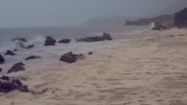 Stormy weather with fine rain on the seashore